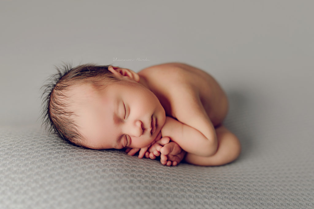 newborn womb pose
